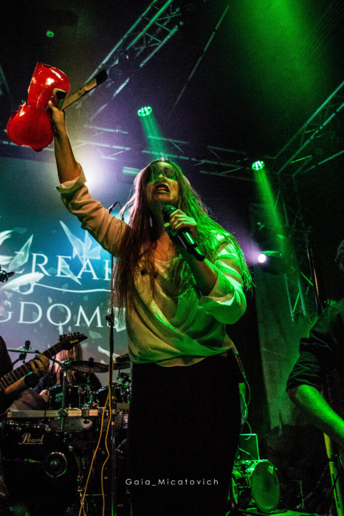 Sofia Schmidt from Ethereal Kingdoms holding a broken violin at Finntroll support show at Gimle. 