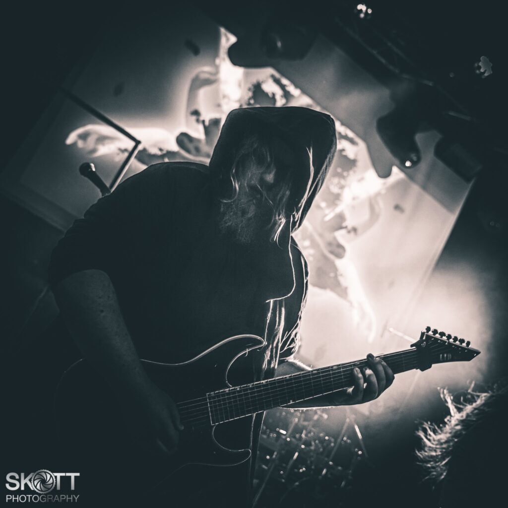 Ethereal Kingdoms live at Wintersun anniversary support show. Guitarist Christian Rasmussen performing on stage at gimle with guitar. 
Portrait by Skoett Photography. 