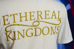 Backside detail with the Ethereal Kingdoms logo in vintage gold.